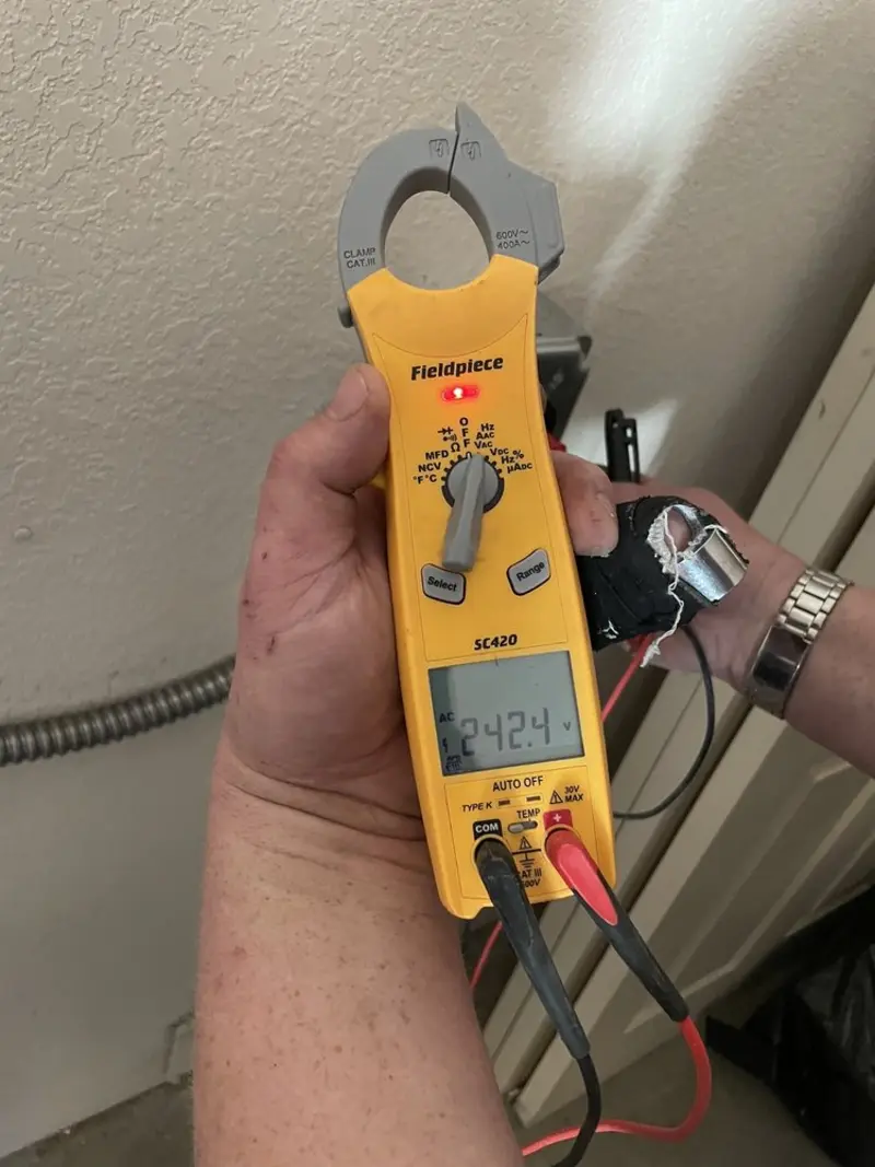 Voltage testing with clamp meter during Recessed Lighting Installation in Oregon